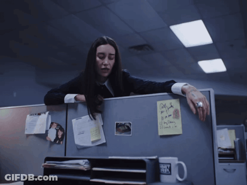 A Woman Leans Over A Cubicle With A Sticky Note On It That Says Call Me If You Need A Day Off GIF