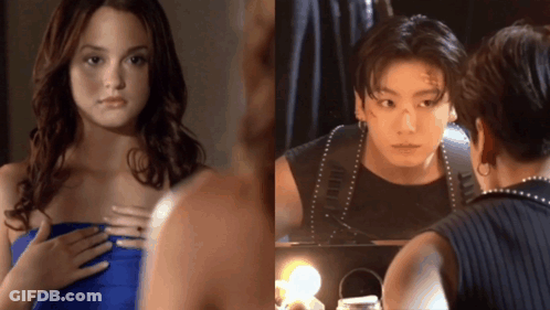 A Woman Looking At Herself In A Mirror And A Man Looking At Himself In A Mirror GIF