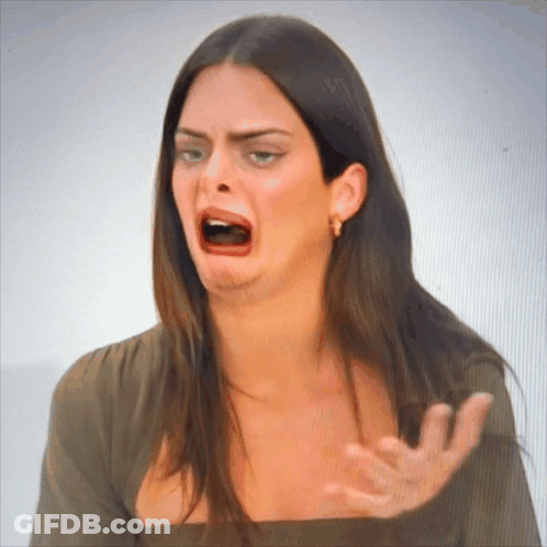 A Woman Making A Funny Face With Her Mouth Wide Open GIF