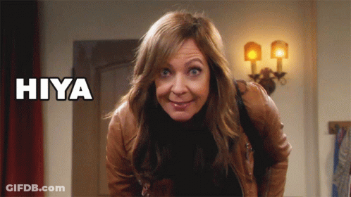 A Woman Making A Funny Face With The Word Hiya Above Her Head GIF