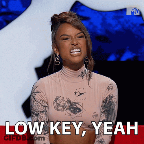 A Woman Making A Funny Face With The Words Low Key Yeah Behind Her GIF