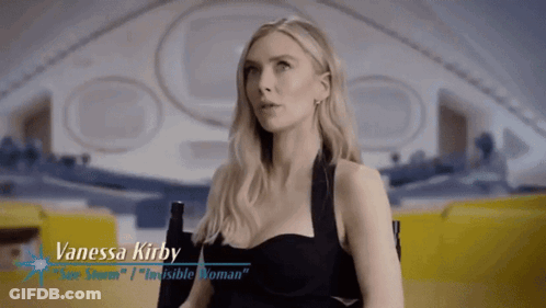 A Woman Named Vanessa Kirby Is Sitting In A Chair In Front Of An Airplane GIF