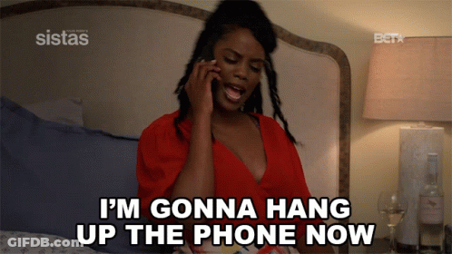 A Woman On A Bed Talking On A Cell Phone And Says I 'M Gonna Hang Up The Phone Now GIF