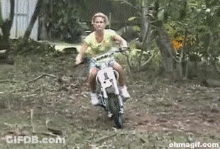 A Woman On A Dirt Bike With The Number 1 On The Front GIF