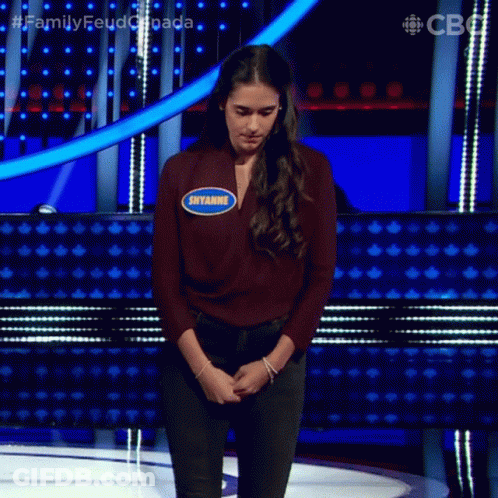 A Woman On A Stage With A Name Tag That Says Siyamge GIF