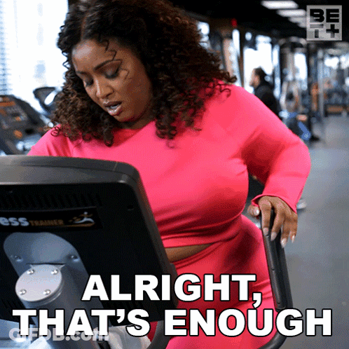 A Woman On An Exercise Bike With The Words Alright That 'S Enough Behind Her GIF