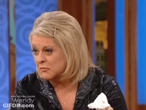 A Woman On Wendy Williams Is Crying And Holding A Tissue GIF