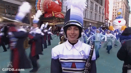 A Woman Playing A Clarinet In A Parade With Nbc Written On The Bottom Right GIF