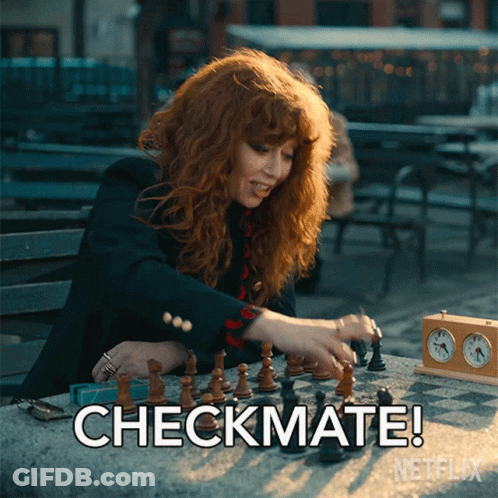 A Woman Playing A Game Of Chess With The Words Checkmate On The Bottom Right GIF