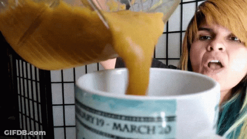 A Woman Pouring Something Into A Mug That Says March 20 On It GIF