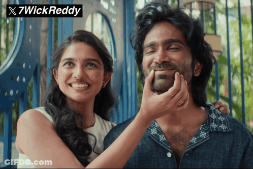 A Woman Putting Her Hand On A Man 'S Face With 7Wick Reddy Written On The Bottom GIF