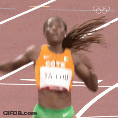 A Woman Running On A Track With The Name Ta Lou On Her Jersey GIF