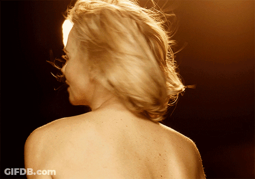 A Woman 'S Back Is Shown In A Close Up GIF