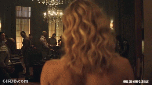 A Woman 'S Back Is Shown In A Mission Impossible Movie GIF
