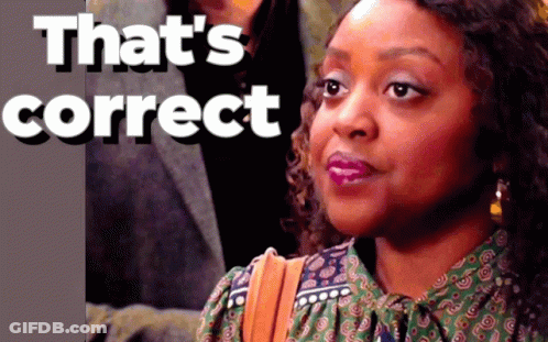 A Woman 'S Face Is Behind A Sign That Says " That 'S Correct " GIF