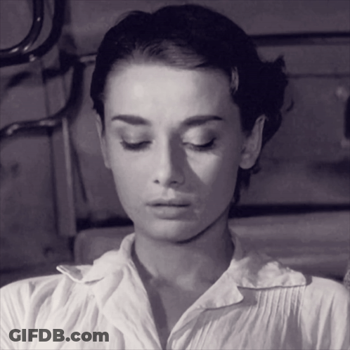 Black And White Photo Of Woman With Eyes Closed GIF