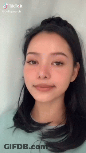 A Woman 'S Face Is Shown With A Tiktok Watermark GIF