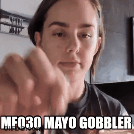 A Woman 'S Face Is Shown With The Words Mf030 Mayo Gobbler Above Her GIF