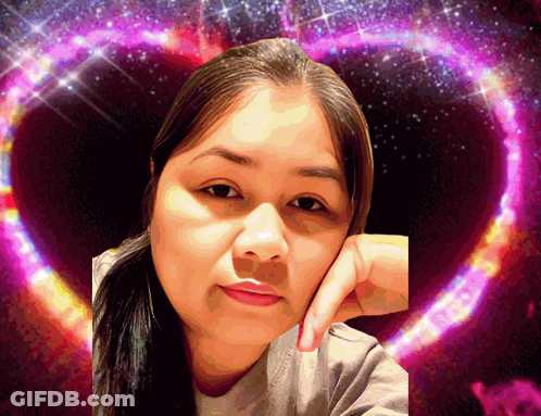 A Woman 'S Face Is Surrounded By A Purple Heart GIF