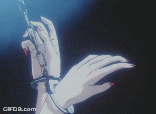 A Woman 'S Hand Is Chained To A Chain GIF