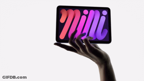A Woman 'S Hand Is Holding A Tablet With A Purple Screen GIF
