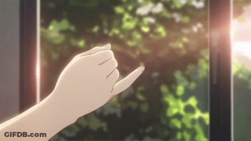 A Woman 'S Hand Is Reaching Out Towards A Window With Trees In The Background . GIF