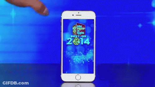 A Woman 'S Hand Is Touching A Cell Phone That Says Best Of 2014 On The Screen GIF