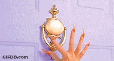 A Woman 'S Hand With Long Nails Is Knocking On A Door . GIF