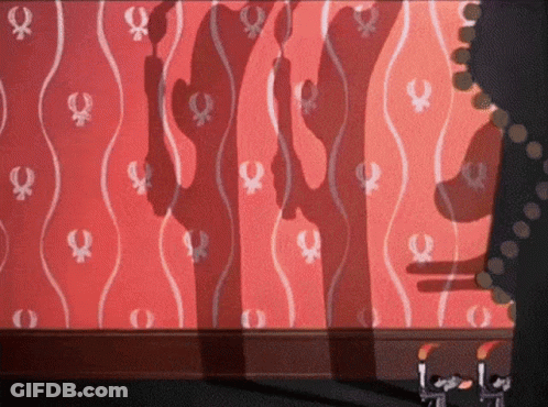 A Woman 'S Shadow Is Projected On A Wall With A Pattern Of Female Symbols GIF