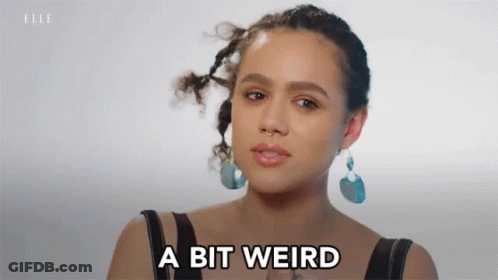 A Woman Says A Bit Weird In Front Of Her Face GIF