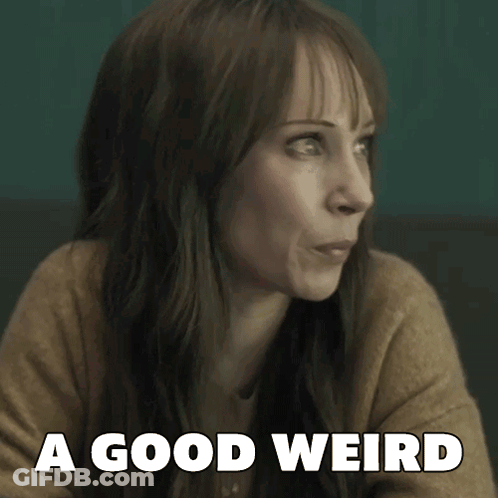 A Woman Says A Good Weird While Looking At Something GIF