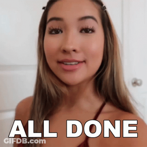 A Woman Says All Done In Front Of A White Background GIF