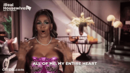 A Woman Says " All Of Me My Entire Heart " In Front Of A Real Housewives Logo GIF
