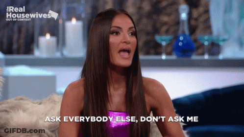 A Woman Says Ask Everybody Else Do N't Ask Me While Sitting On A Couch GIF