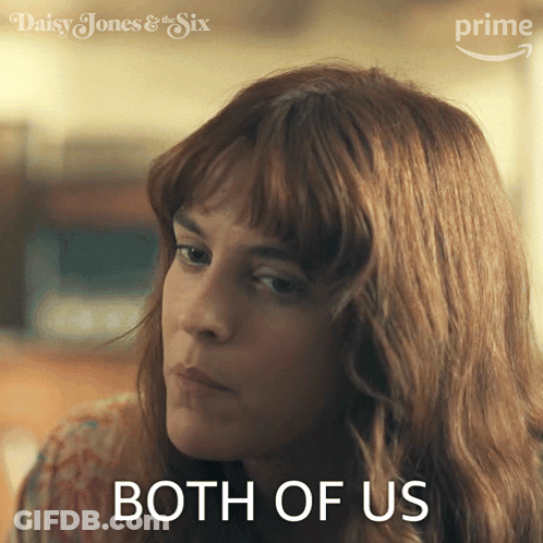 A Woman Says Both Of Us In Front Of A Daisy Jones & The Six Logo GIF