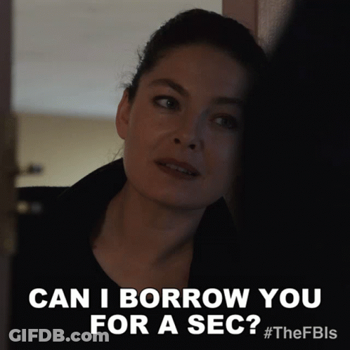 A Woman Says " Can I Borrow You For A Sec " While Leaning Against A Wall GIF