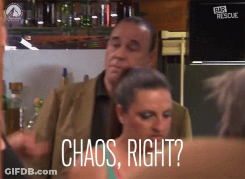 Woman Saying Chaos In Front Of Man In Suit GIF