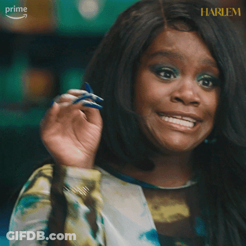 A Woman Says Checkmate With Her Hand Up GIF