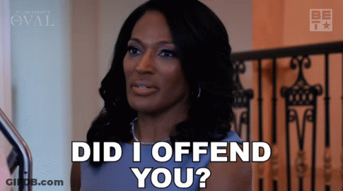 A Woman Says Did I Offend You While Standing In Front Of A Railing GIF