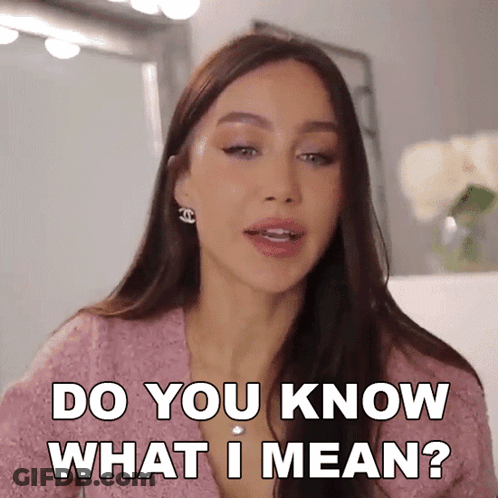 A Woman Says Do You Know What I Mean In A Pink Shirt GIF