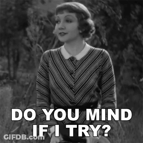 A Woman Says Do You Mind If I Try In A Black And White Photo GIF