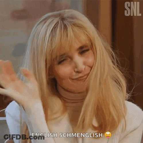 A Woman Says English Schmenglish With A Smiley Face On Her Face GIF