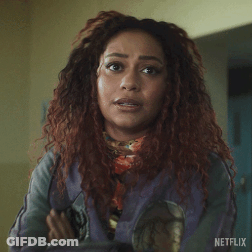 A Woman Says Everyone Has Skeletons In Front Of A Netflix Logo GIF