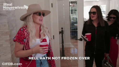 A Woman Says Hell Hath Not Frozen Over While Holding Two Red Cups GIF