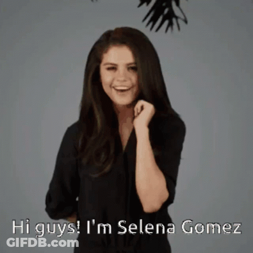 A Woman Says Hi Guys I 'M Selena Gomez In A Black Shirt GIF