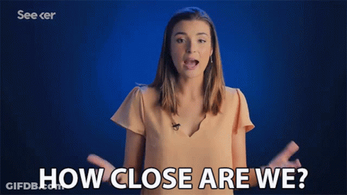 A Woman Says How Close Are We With Her Hands Outstretched GIF