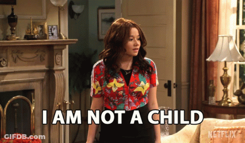 A Woman Says I Am Not A Child While Standing In A Living Room GIF