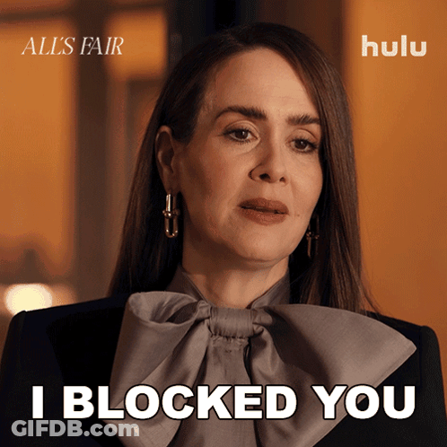 A Woman Says " I Blocked You " In Front Of A Hulu Logo GIF