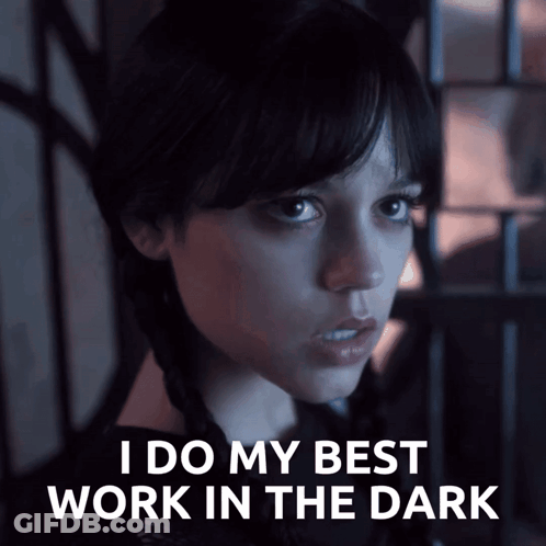 A Woman Says " I Do My Best Work In The Dark " In A Dark Room GIF