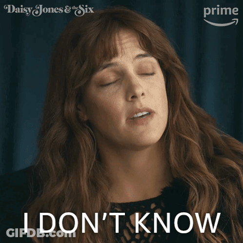 A Woman Says I Do N't Know In Front Of A Poster For Daisy Jones & The Six GIF